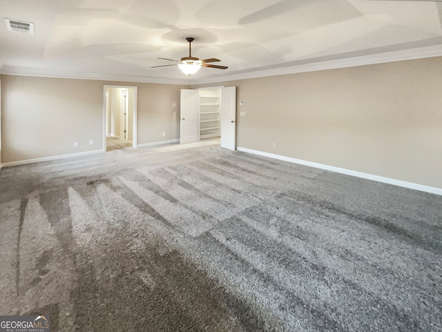 carpeted empty room with ceiling fan and ornamental molding