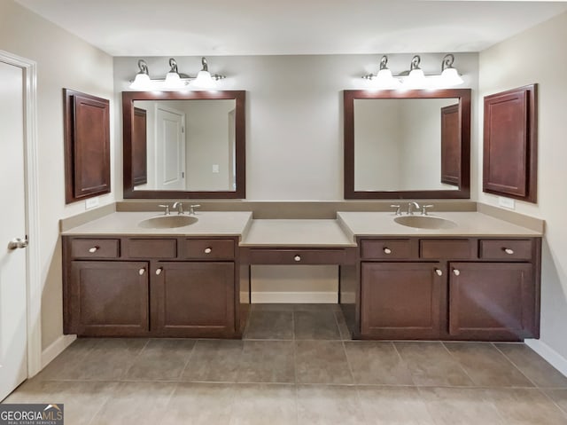 bathroom featuring tile patterned flooring and vanity