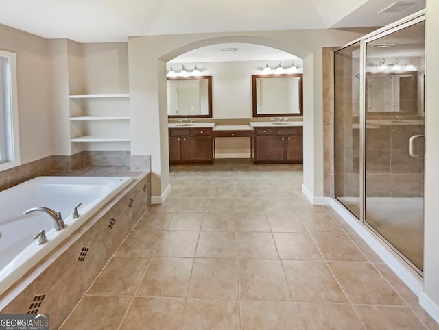 bathroom featuring tile patterned floors, separate shower and tub, and vanity