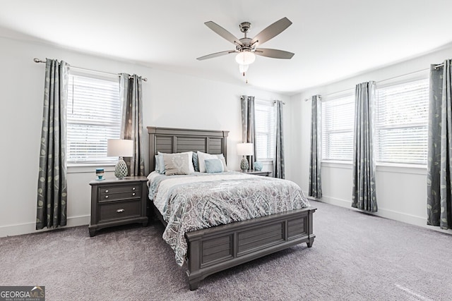 bedroom with ceiling fan and carpet