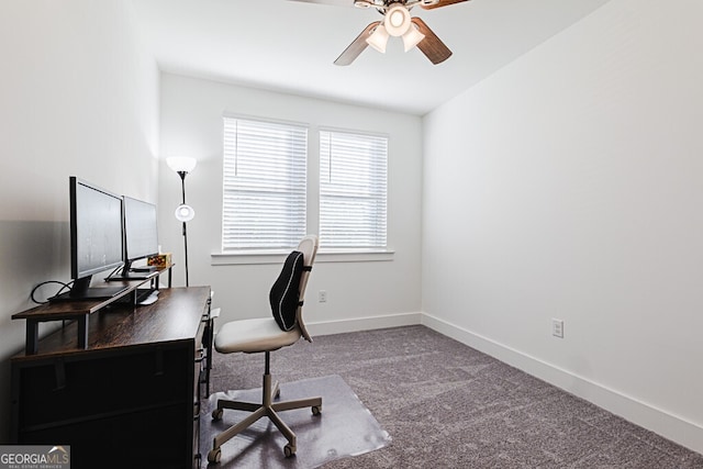 carpeted home office featuring ceiling fan