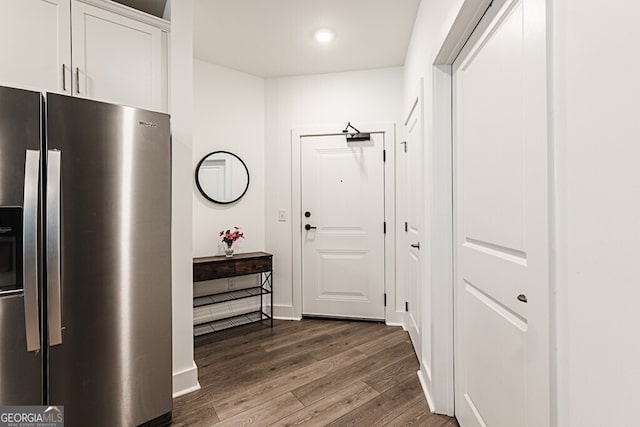 hall with dark hardwood / wood-style floors