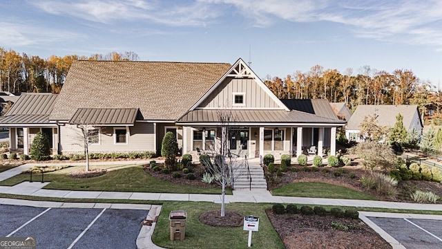 view of front facade with a front yard and a porch