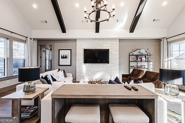 living room with vaulted ceiling with beams, dark hardwood / wood-style flooring, and plenty of natural light