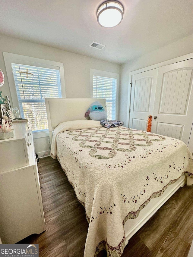 bedroom featuring dark hardwood / wood-style floors