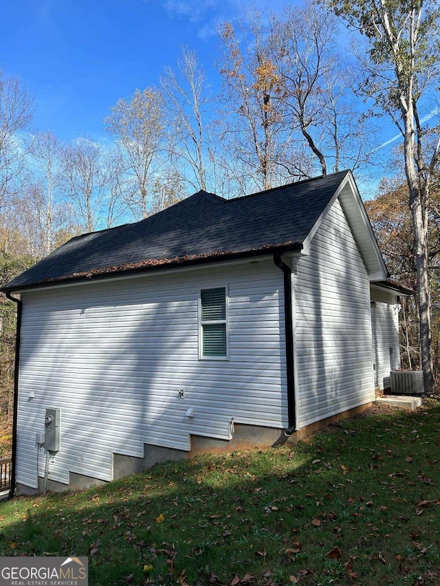 view of property exterior with a yard