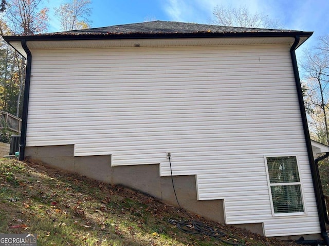 view of side of property with central AC