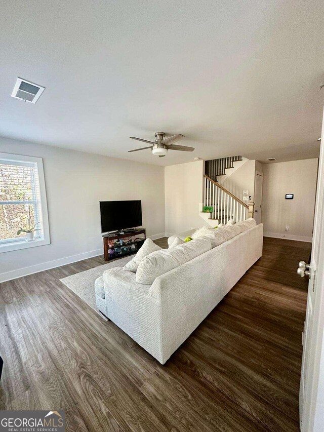 living room featuring dark hardwood / wood-style flooring