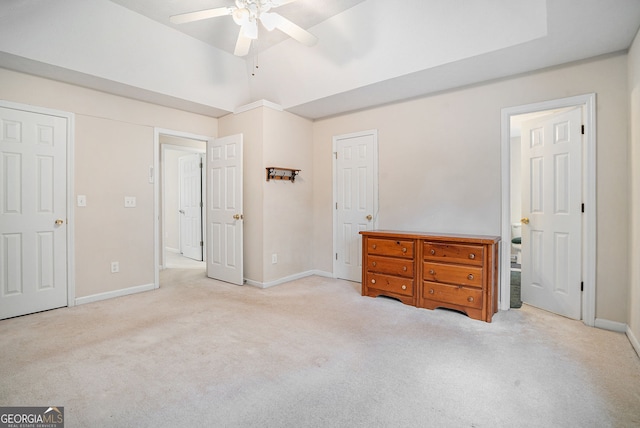 bedroom featuring carpet floors, baseboards, and lofted ceiling