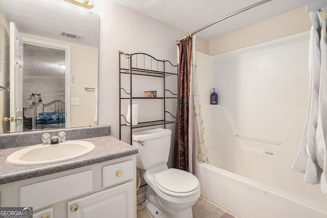 full bath featuring a textured ceiling, toilet, vanity, and visible vents