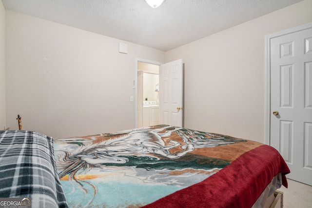 carpeted bedroom with a textured ceiling