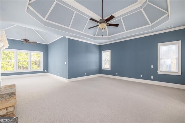 carpeted spare room with ceiling fan and crown molding