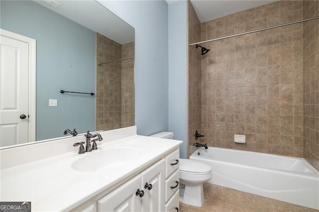 full bathroom with vanity, toilet, tile patterned flooring, and tiled shower / bath combo