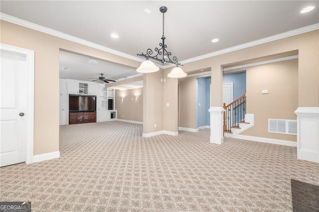 interior space with ceiling fan, crown molding, and light colored carpet