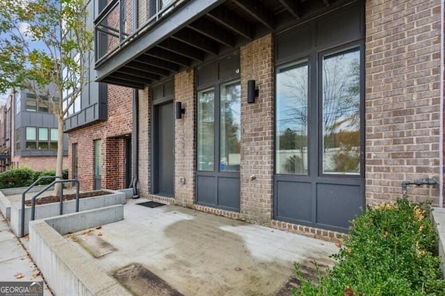 doorway to property with a patio