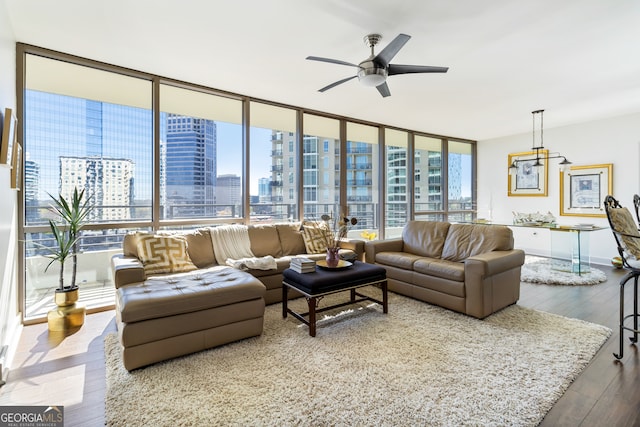 living room featuring floor to ceiling windows, hardwood / wood-style floors, and ceiling fan