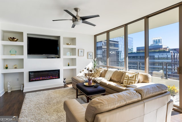 living room featuring built in shelves, ceiling fan, and dark hardwood / wood-style flooring