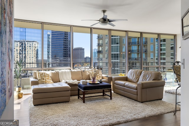 living room with wood-type flooring and a wealth of natural light