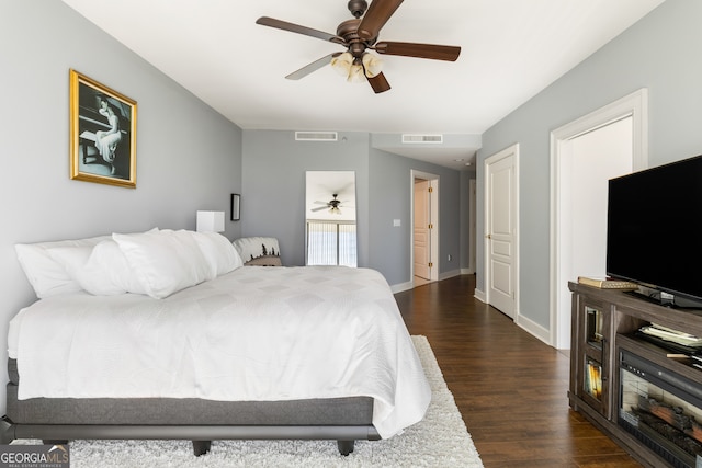 bedroom featuring ceiling fan and dark hardwood / wood-style flooring