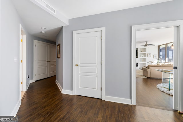 hallway featuring dark hardwood / wood-style floors