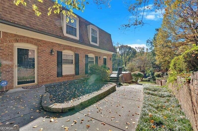 back of house with a patio