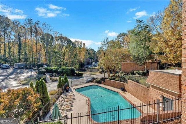 view of swimming pool featuring a patio