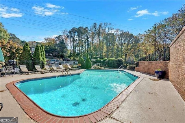 view of swimming pool with a patio