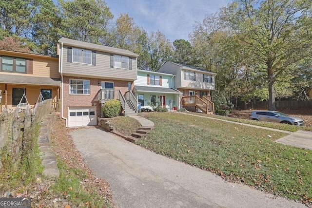 view of property featuring a front lawn and a garage