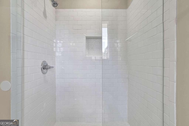 bathroom with a tile shower