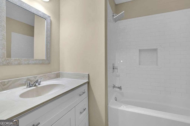 bathroom featuring vanity and tiled shower / bath combo