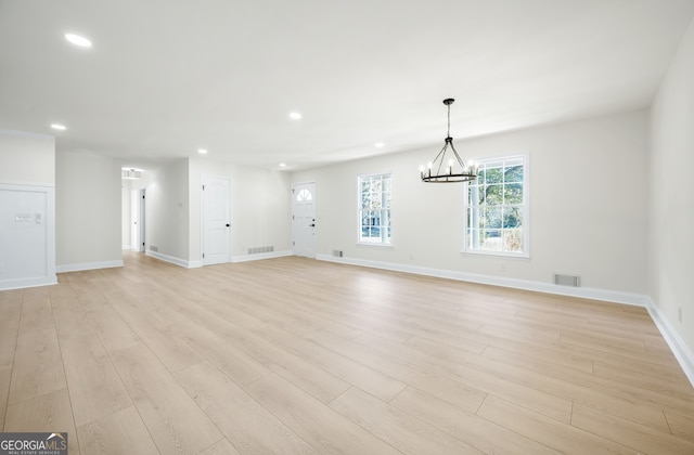 interior space featuring recessed lighting, visible vents, and light wood finished floors