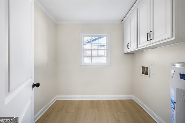 laundry area with light wood finished floors, hookup for a washing machine, cabinet space, water heater, and baseboards