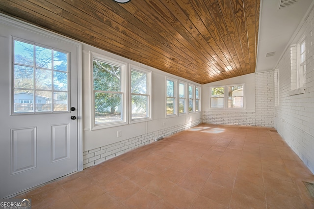 unfurnished sunroom with lofted ceiling, wooden ceiling, and visible vents