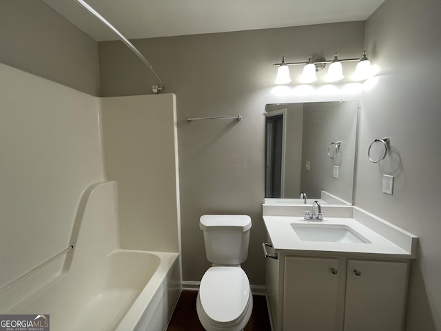 full bathroom featuring toilet, vanity, and shower / bathing tub combination