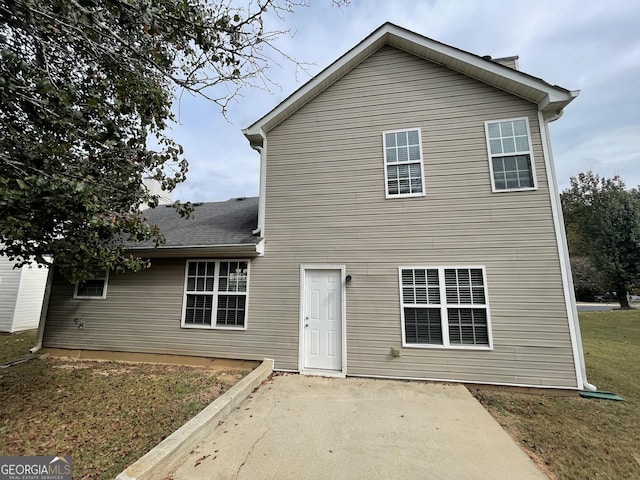 back of property with a patio area