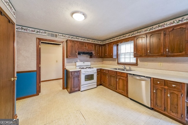 kitchen with dishwasher, white range with gas cooktop, sink, and a textured ceiling