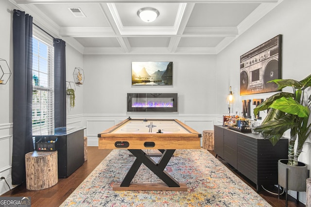 rec room with beamed ceiling, dark wood-type flooring, crown molding, and coffered ceiling