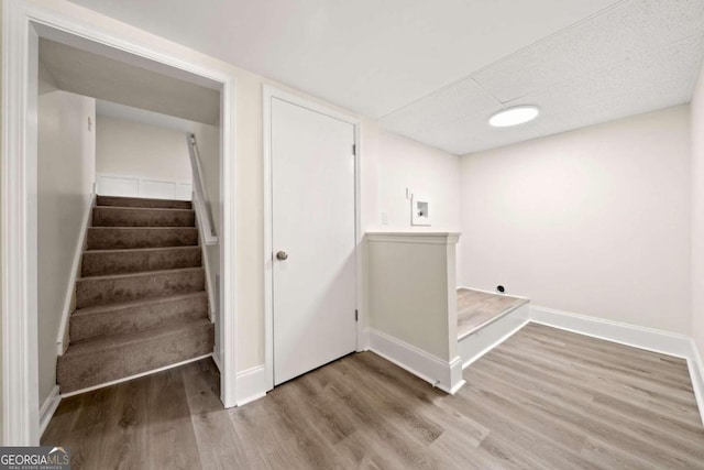 stairway featuring hardwood / wood-style floors