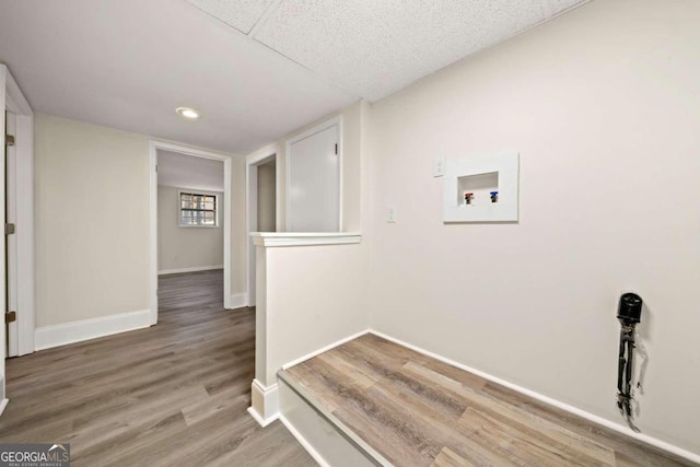 laundry room featuring washer hookup and wood-type flooring