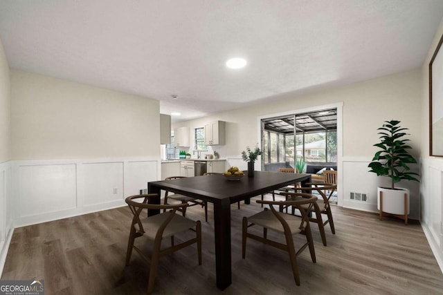 dining area featuring dark hardwood / wood-style flooring