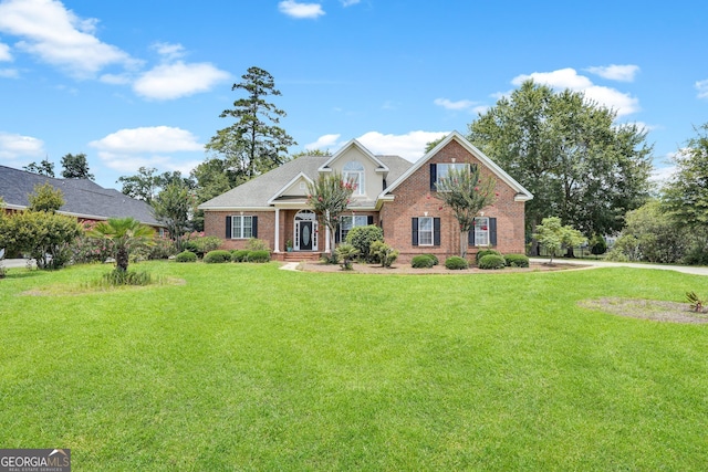 view of front facade featuring a front yard