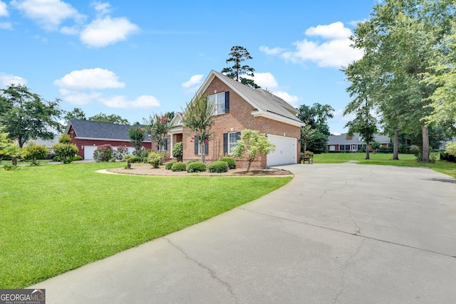 view of front of house with a front yard and a garage