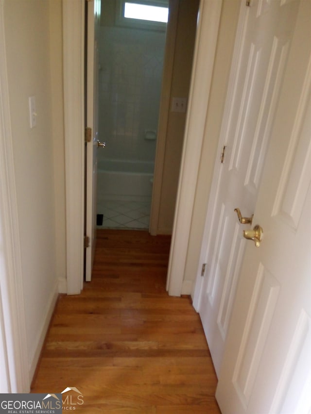 hallway featuring light hardwood / wood-style floors