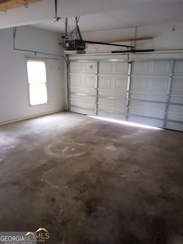 garage featuring a garage door opener