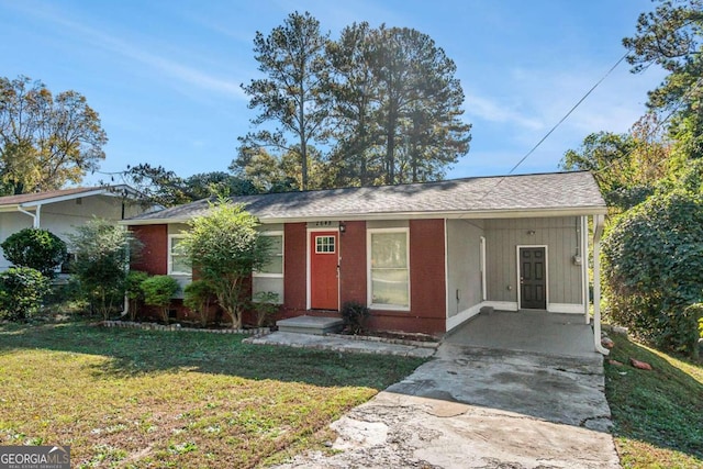 single story home with a front lawn and a carport