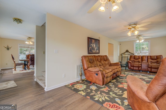 living room with hardwood / wood-style floors and ceiling fan