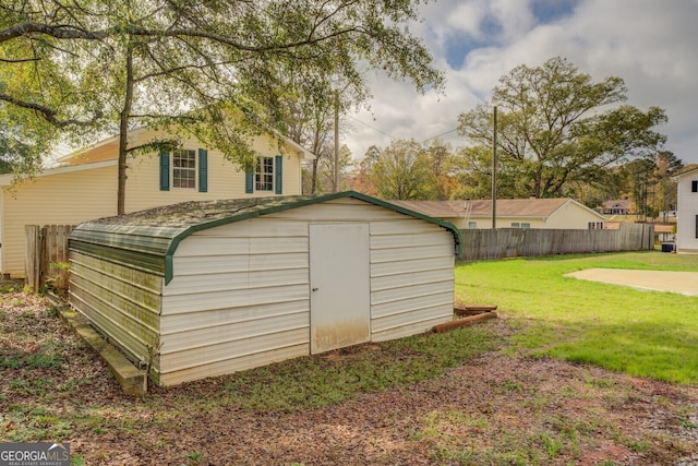 view of outbuilding with a lawn