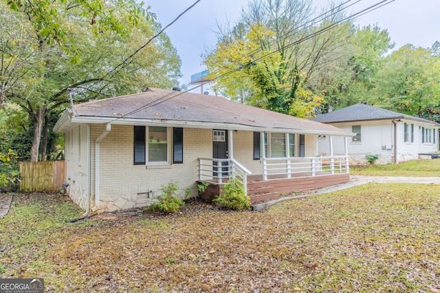 ranch-style house with covered porch