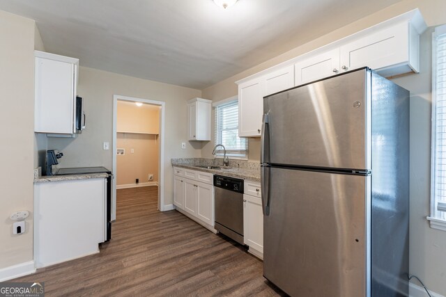 kitchen featuring white cabinetry, dark hardwood / wood-style floors, and appliances with stainless steel finishes