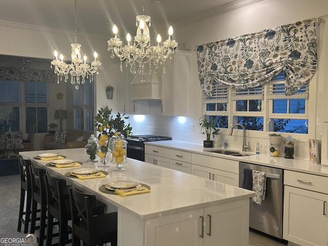 kitchen with white cabinetry, sink, stainless steel dishwasher, range, and light stone countertops